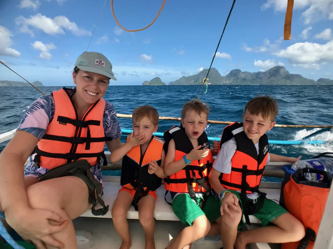 boys on boat + mom.jpg