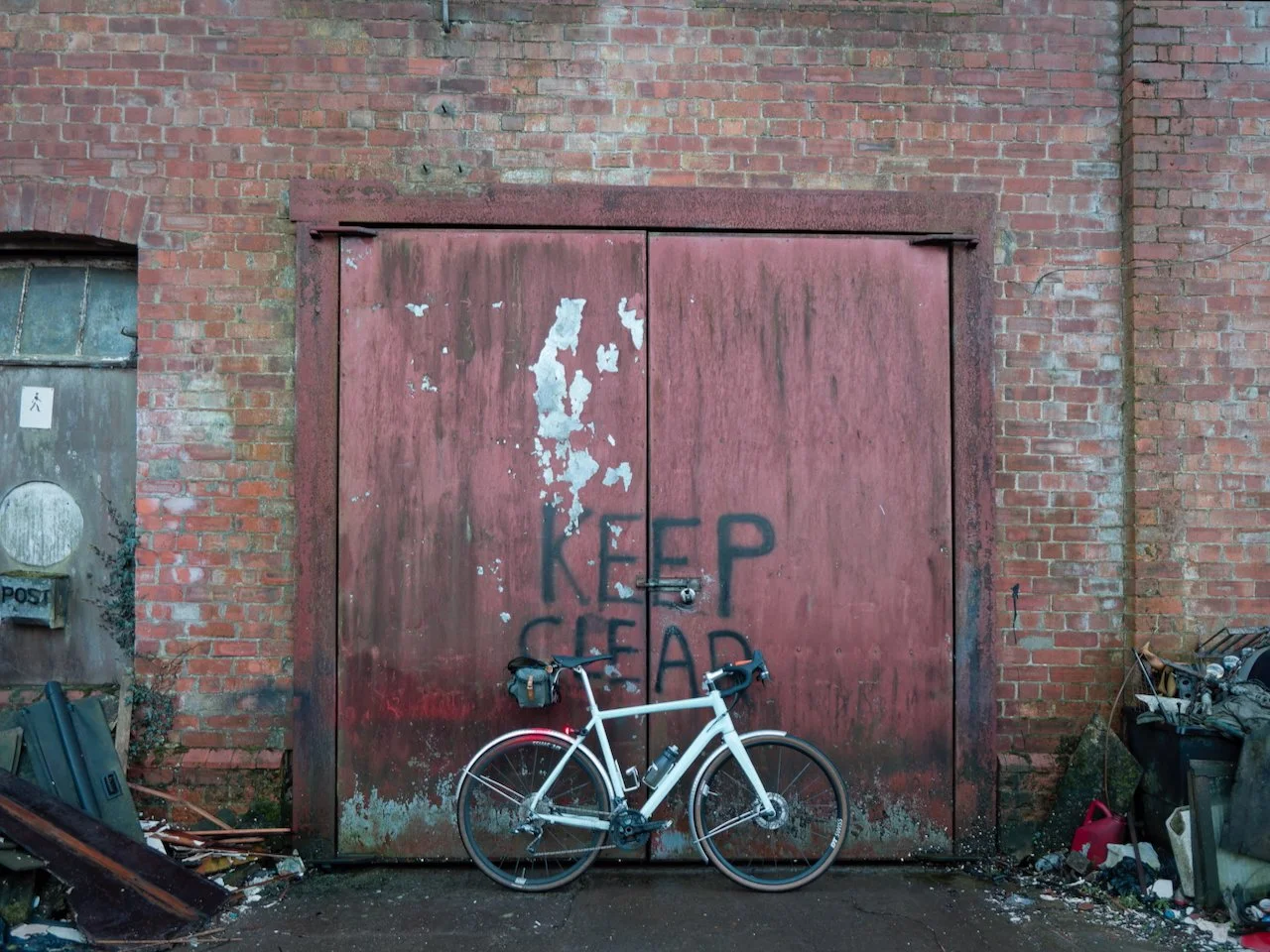 I have certain locations - often old barns with wrinkly tin and peeling paint, where I stop to take photos. You can over do this, but the compulsion to stop at a beloved spot is too strong to ride by. This place on the outskirts of Wigtown is such a 