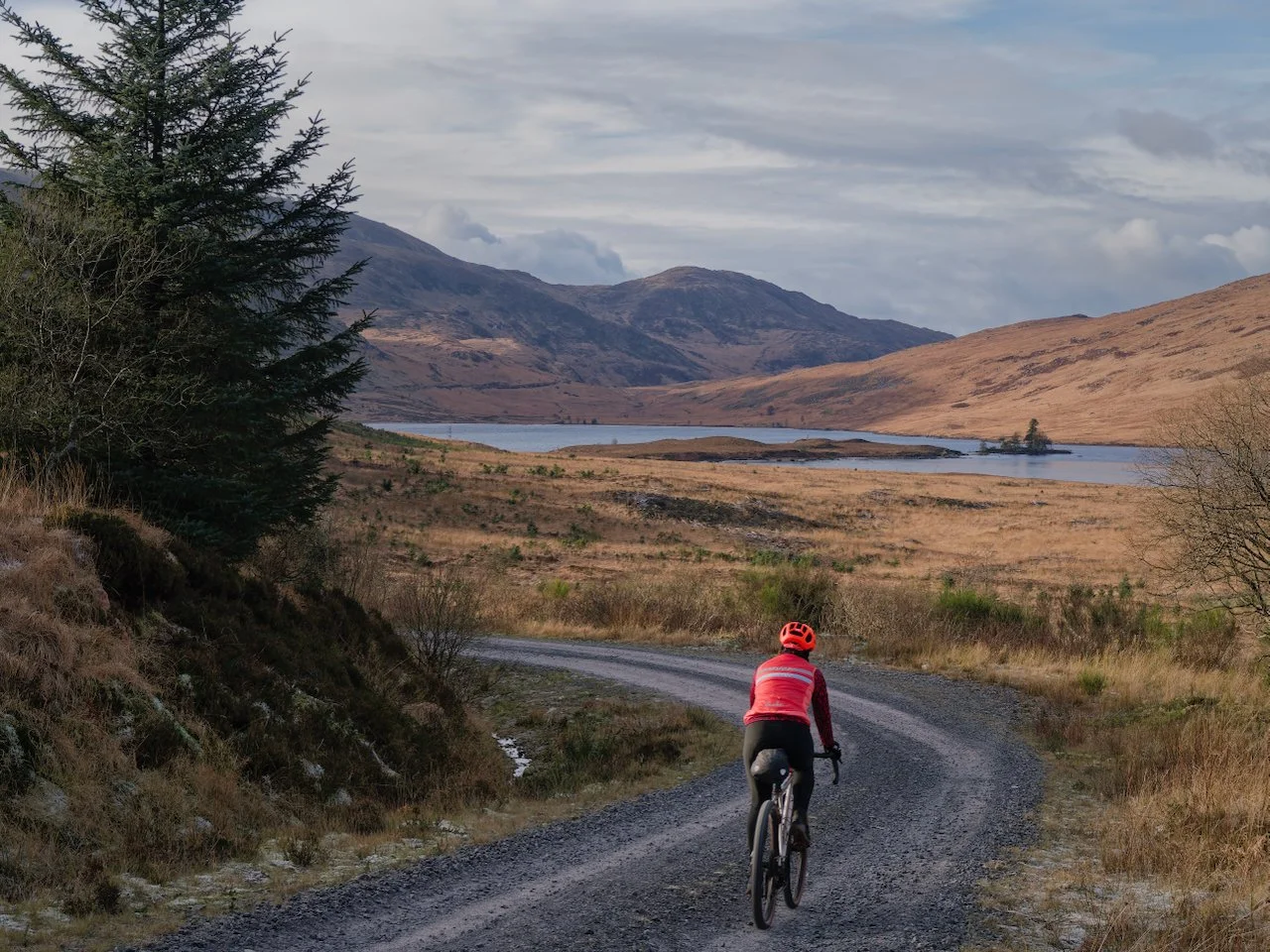 woman riding gravel bike Loch Dee, Galloway