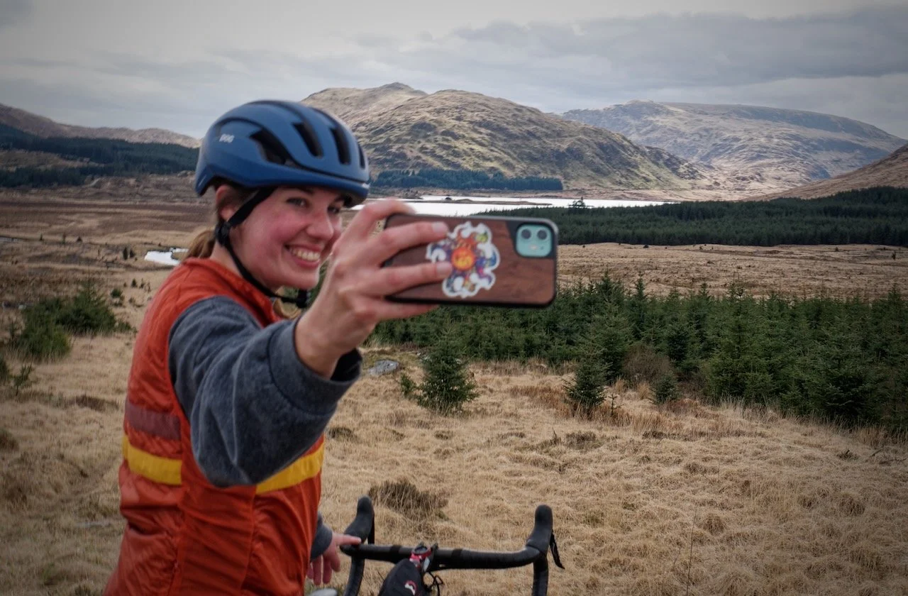 Happy Galloway Gravel Holidays guided cyclist woman in Galloway's heart of the UNESCO Biosphere in South of Scotland