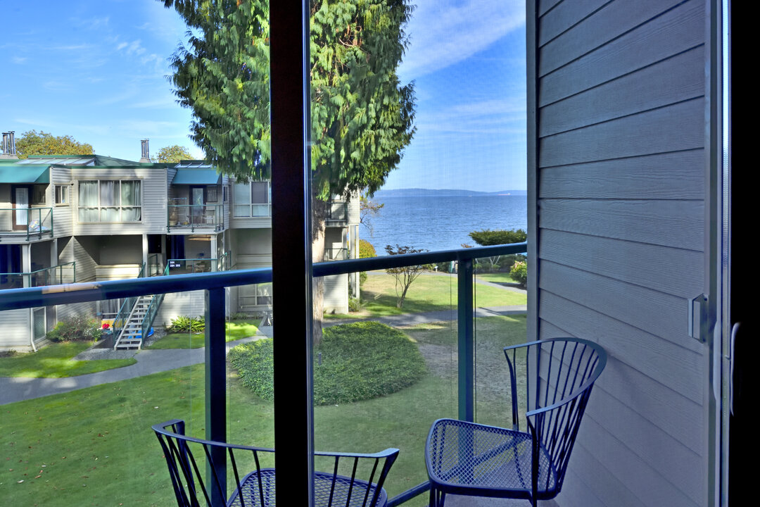 bedroom 2 deck ocean view with chairs.jpg