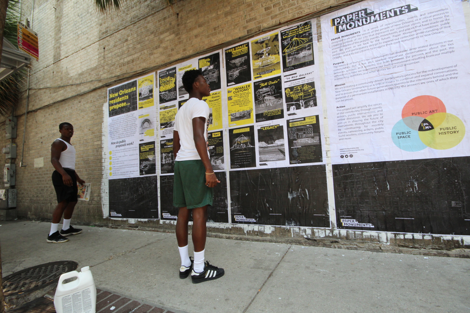  High-school students Bryson and Tyson read Public Proposal panels at the Elk Place site.  