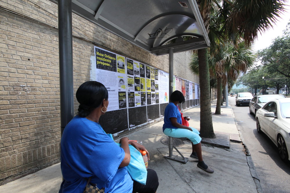  Lauren and Cynthia, passing through the bus stop, read Public Proposal panels at the Elk Place site.  