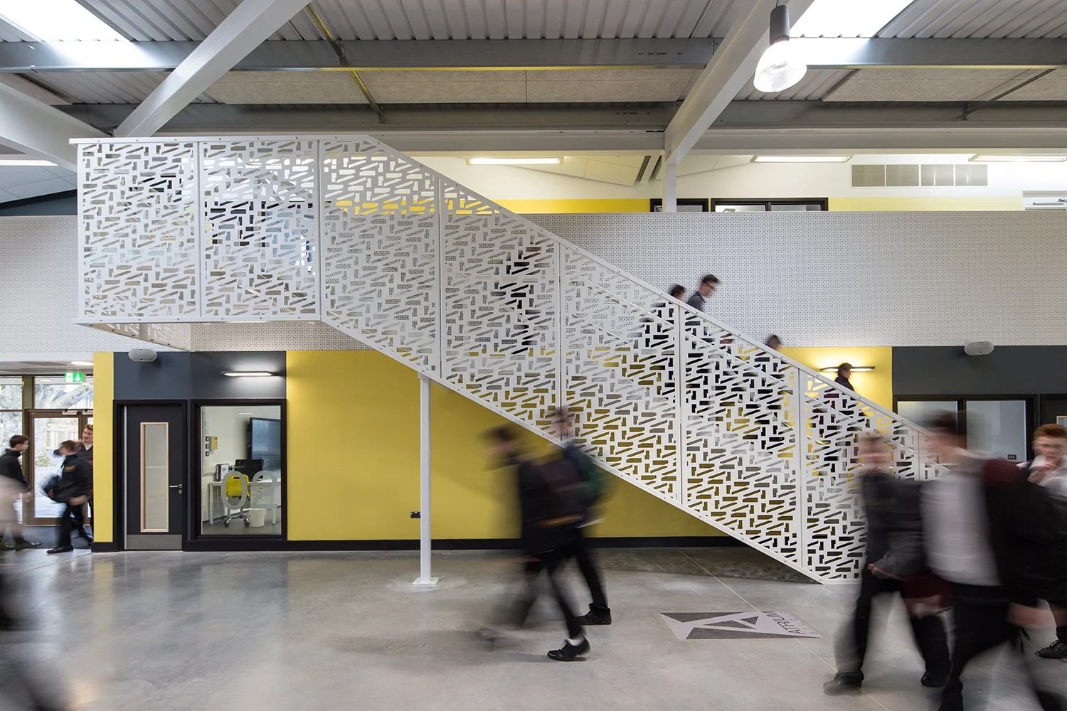  Mechanical systems and structure are exposed, with sizes and design loading identified graphically to integrate with the school’s specialism in construction. This industrial language (the plan of the school forms the pattern to its stair balustrade)