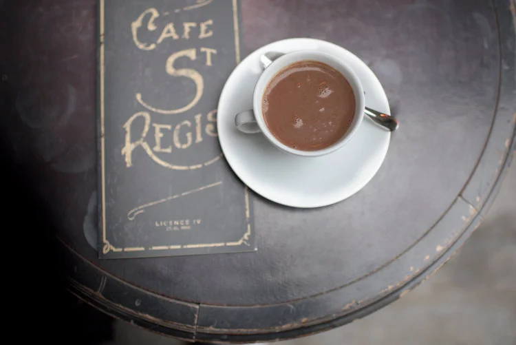 Paris pictures - coffee cup and menu on St. Regis cafe table