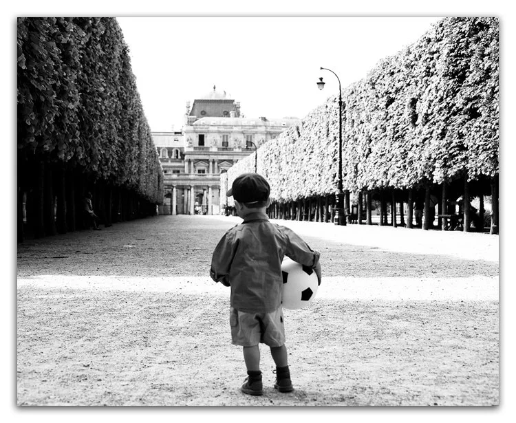 Paris pictures, young boy with football at Palais Royal, black and white print