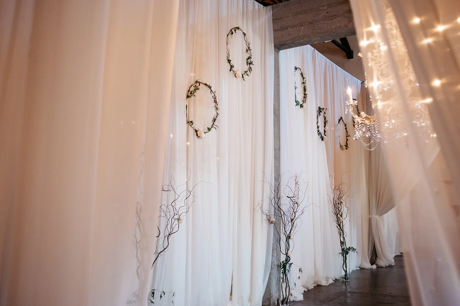 Drapery by Three Palms Events. Floral by Rodarte Floral Design.