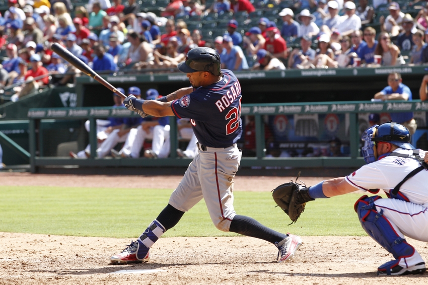 Jul 10, 2016; Arlington, TX, USA; Minnesota Twins center fielder Eddie Rosario (20) singles in a run in the seventh inning against the Texas Rangers at Globe Life Park in Arlington. Mandatory Credit: Tim Heitman-USA TODAY Sports
