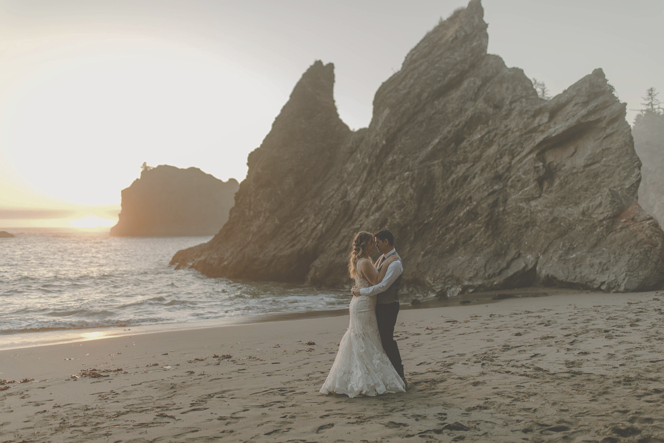 a couple dancing on a beach in southern oregon