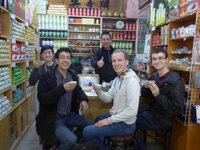 A group getting samples in a tea shop at the Shilin night market.