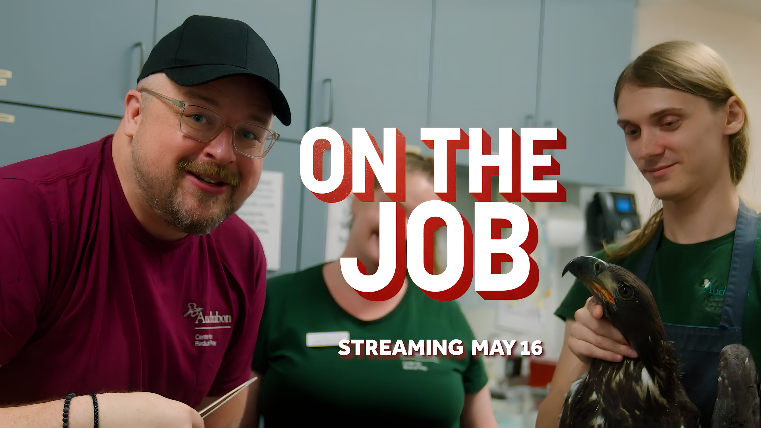 Group of three people working with a duck in a kitchen, with text overlay reading 'On the Job' and info about streaming on May 16.