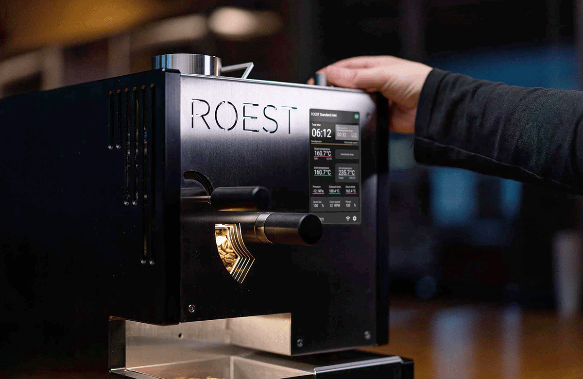 adjusting settings on the ROEST L200 Ultra control panel during a roast, demonstrating intuitive design and advanced automation
