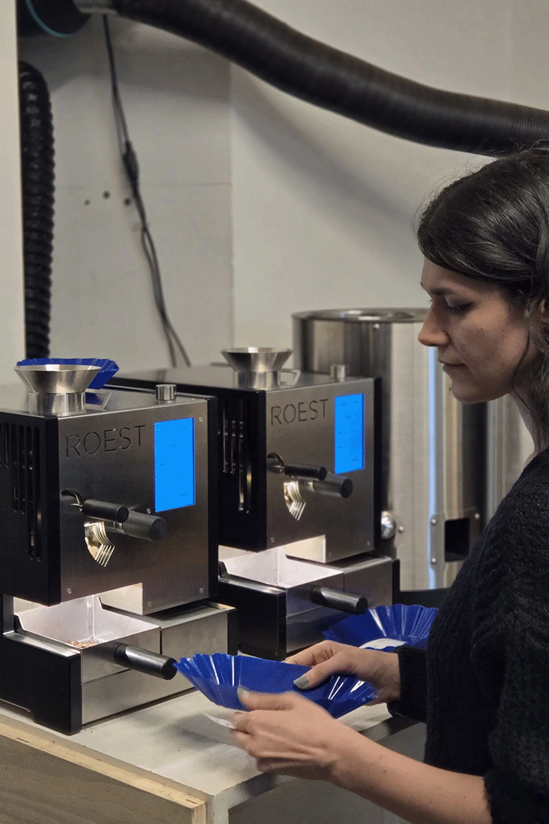 Quality control lab at Cafe Imports, green coffee importer, roasting on two ROEST sample roaster side by side