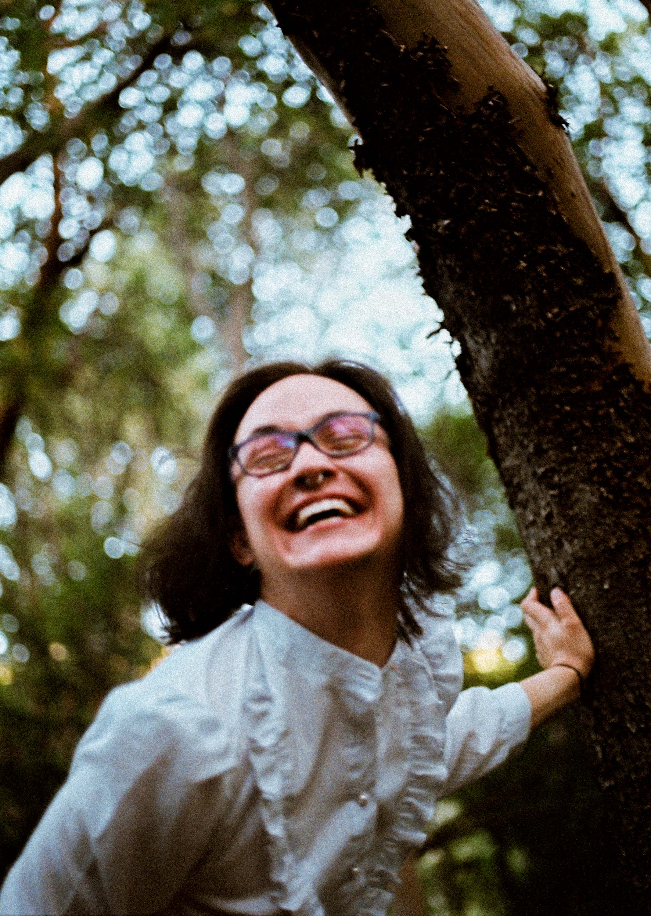 Owen laughing hand on tree.jpg
