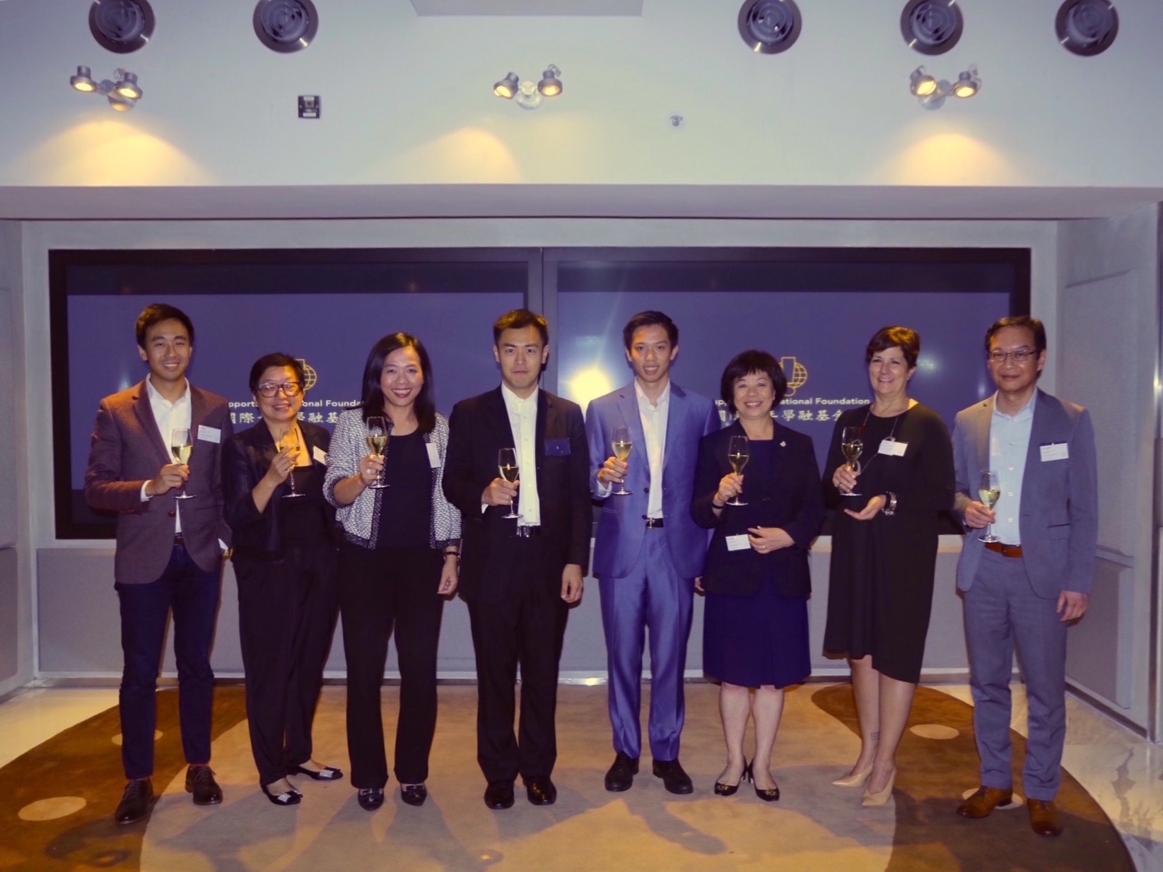 Board of Directors Toast (L-R: Gary Liu, Anna Lo, Jacqueline Lam, Chairman Ming Wai Lau, Founder & President Joseph Wan, Bonnie Ngan, Abigail DeLessio, C S Wai)