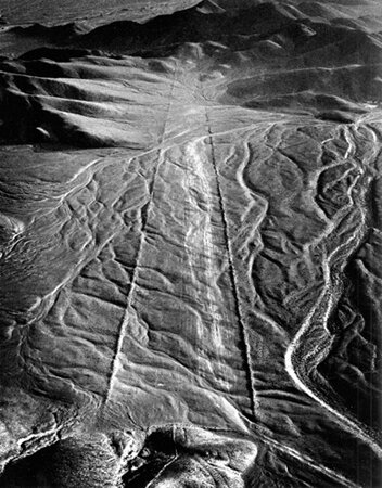  Nazca, Pathway to Infinity, 1979. "False Trapezoidal Figures" consist of two perfectly straight lines, each about three feet wide, that extend for miles across the pampa until they become lost in the foothills of the Andes. The lines are actually pa