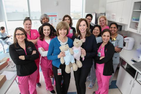 Dr. Nancy Hurst (center, in blue) with her colleagues at Texas Children's Hospital