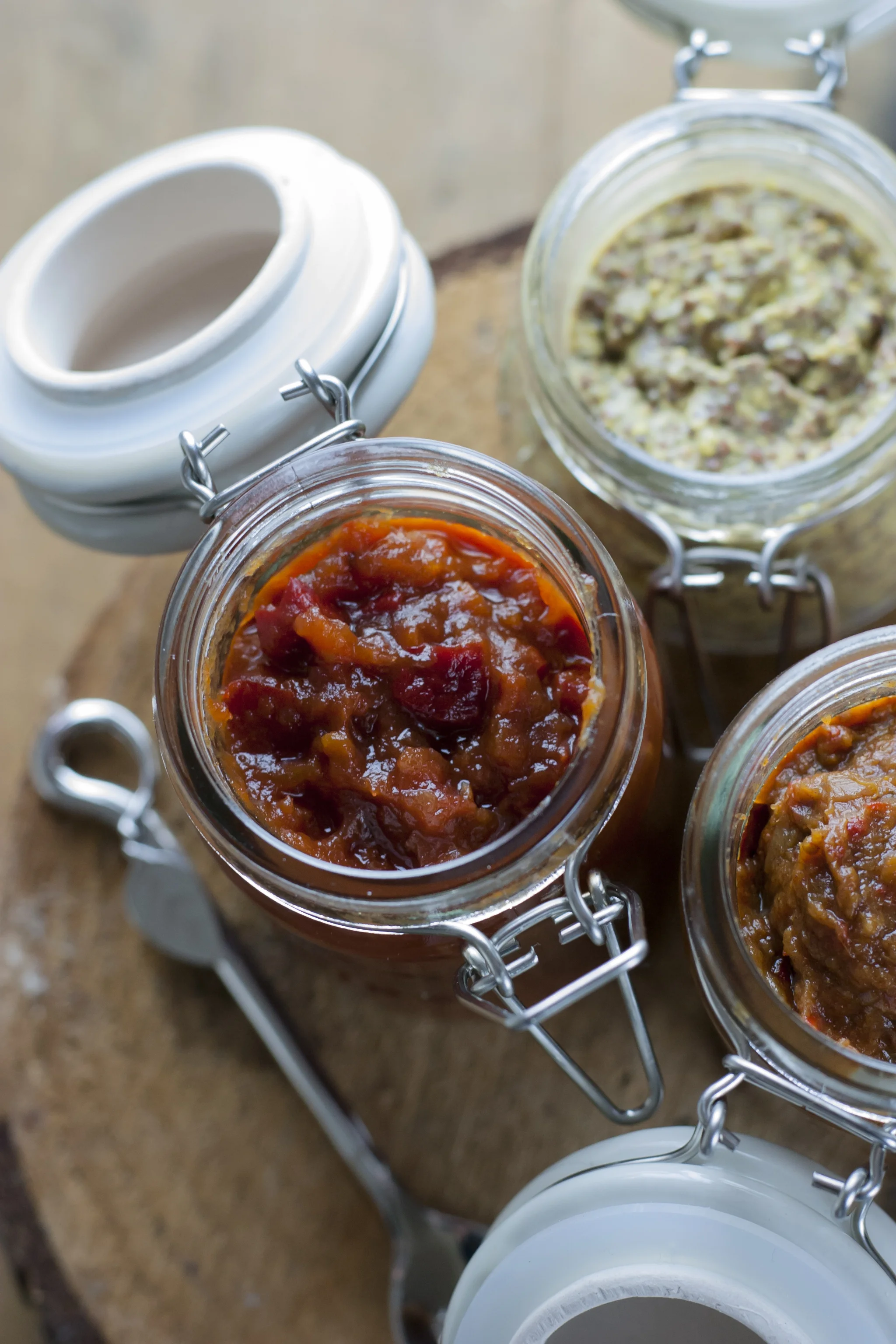 Three jars of chutneys viewed from above
