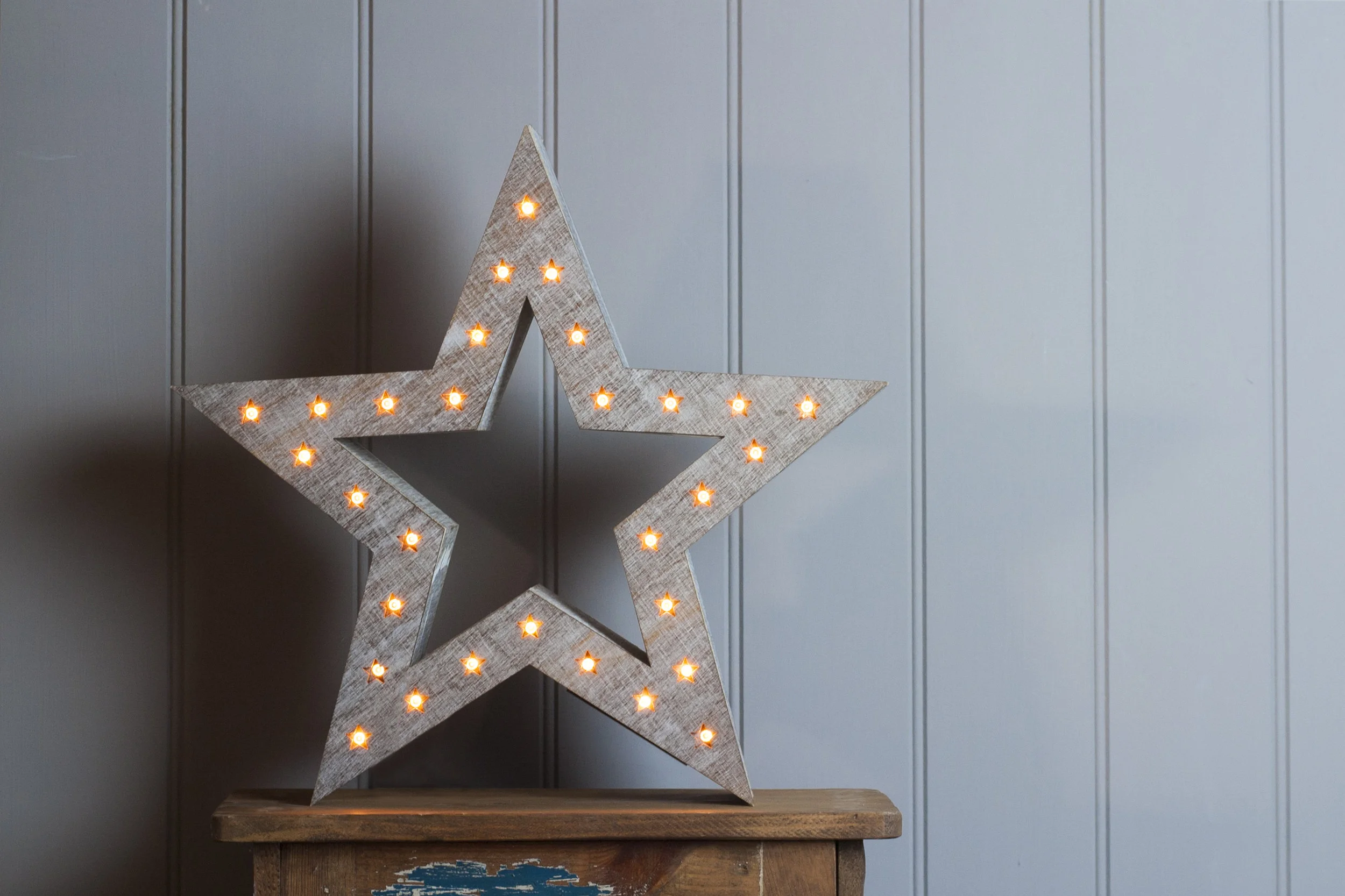 wooden Christmas star with lights embedded