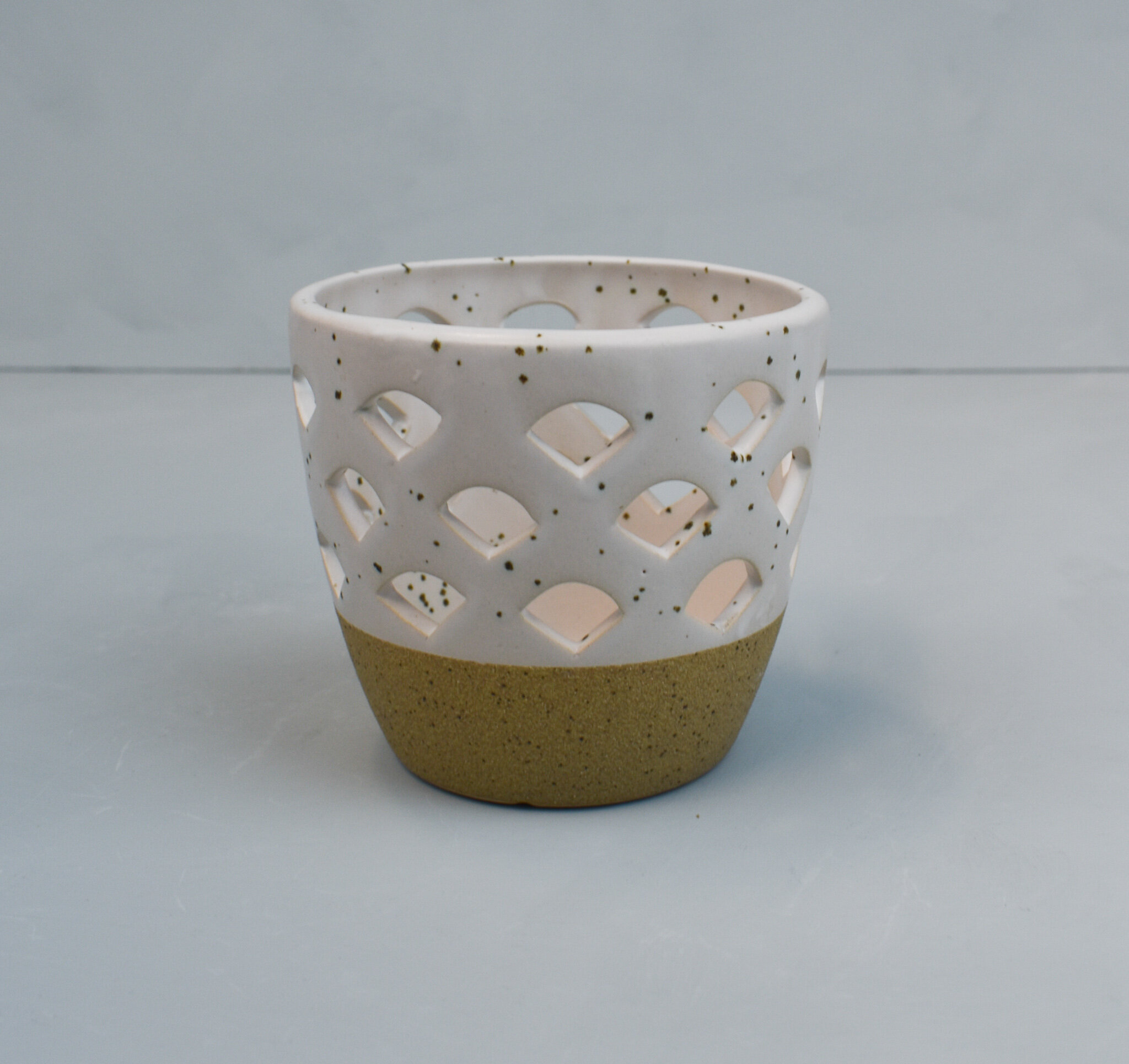 Two-tone speckled ceramic t-light holder, by Bloomingville