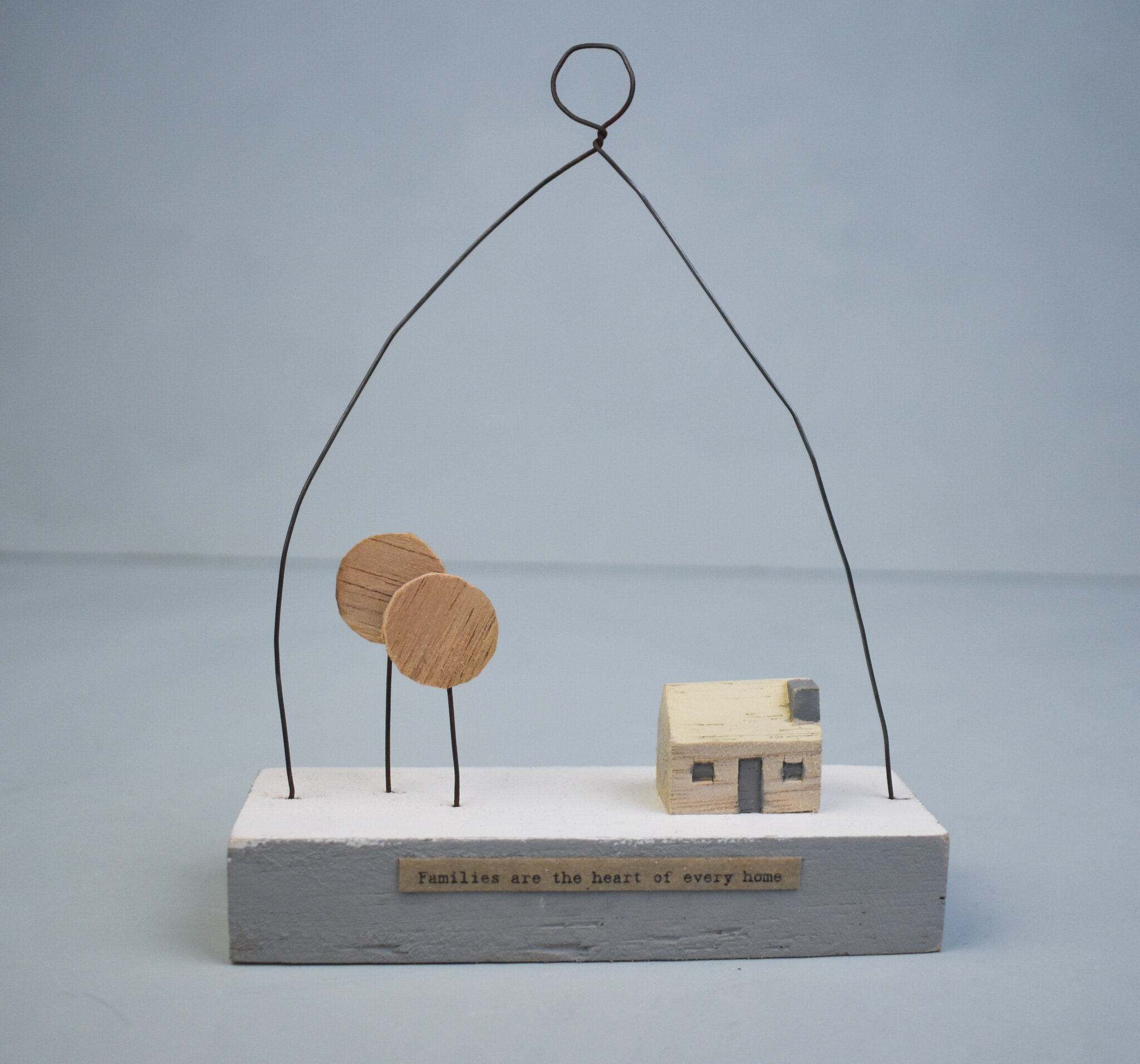 'Families are the heart' wooden hanger, by East of India