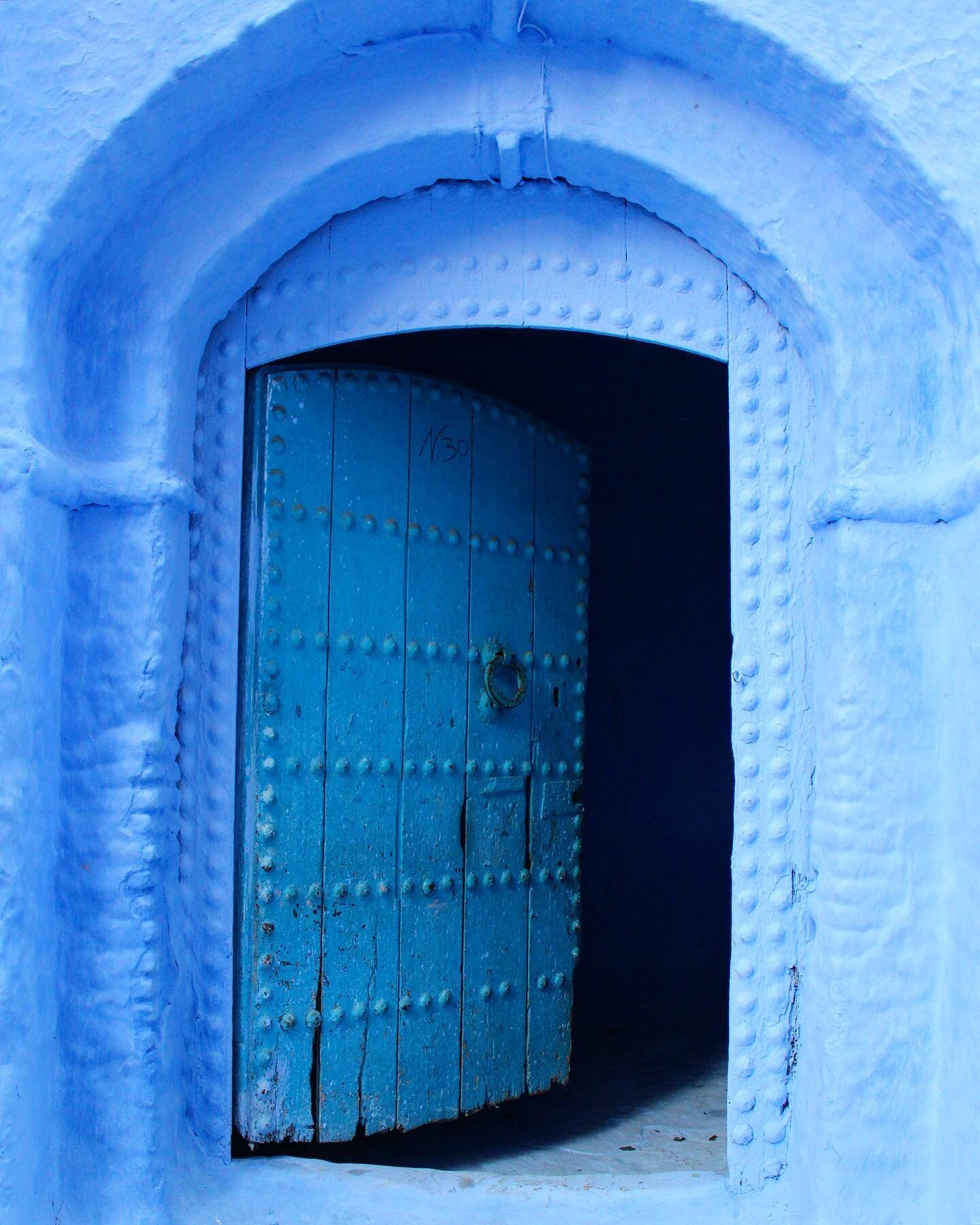 Why are Chefchaouen's walls blue? There are several theories as to why the walls were painted blue. One popular theory is that the blue keeps mosquitos away. The blue is said to symbolize the sky and heaven, and serve as a reminder to lead a spiritua