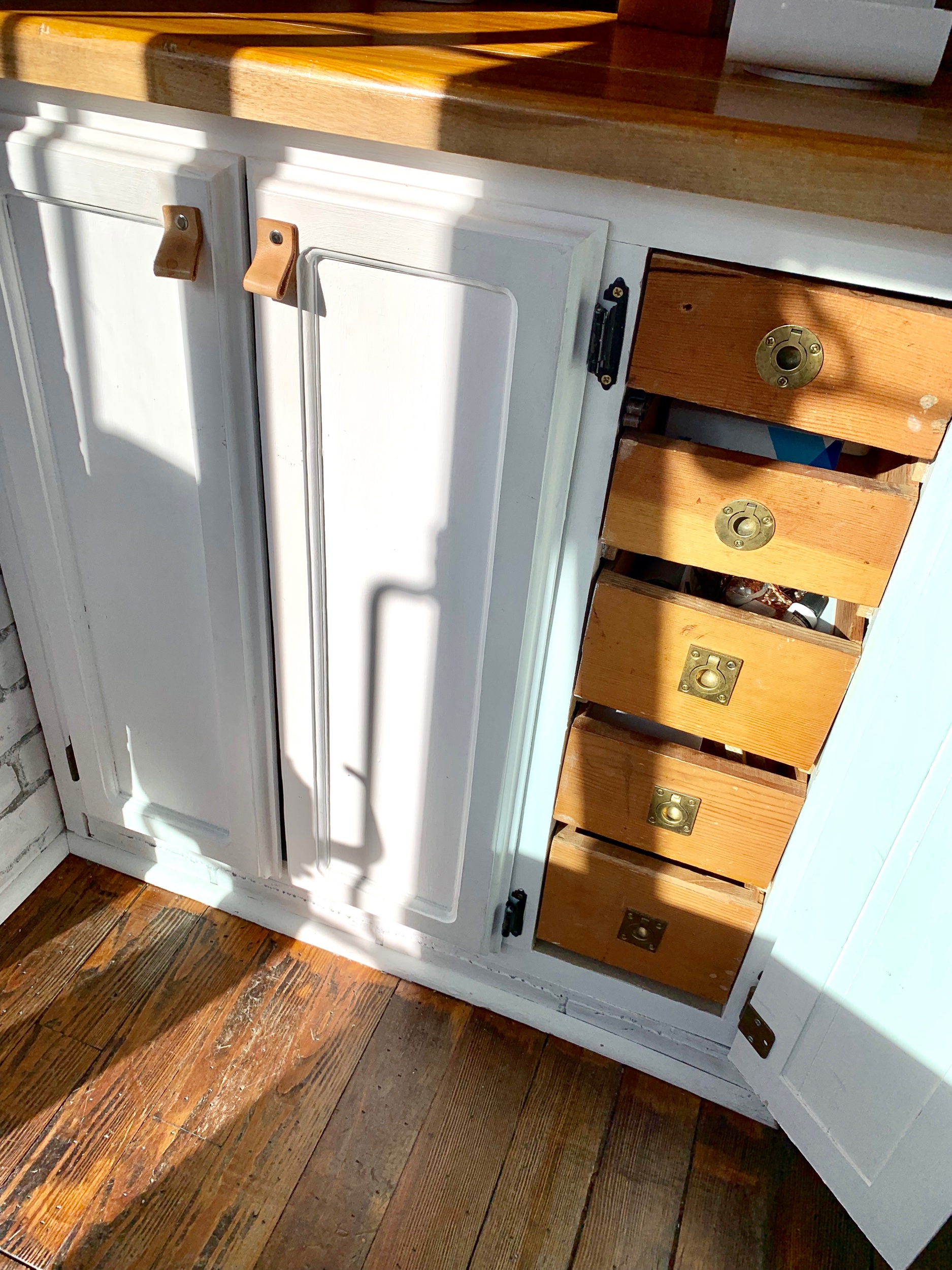 The cabinet turned checkout counter repurposed from their friend’s home remodel had a perfect set of drawers already built in