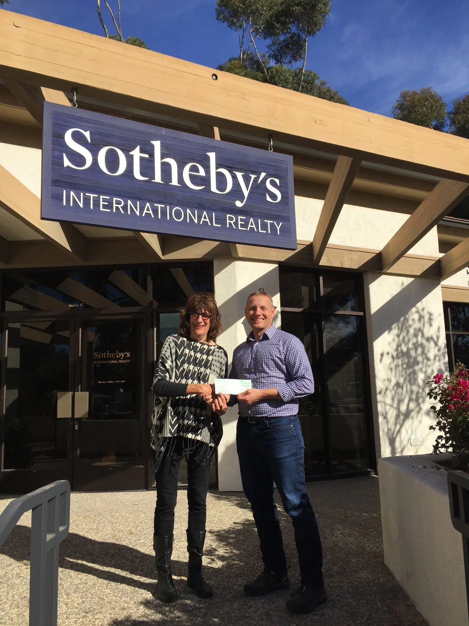 Hillary Hauser accepts donation from Sotheby's International Realty for 8th year in a row! (Rich van Seenus of Sotheby's International Realty, Montecito office does the honors)