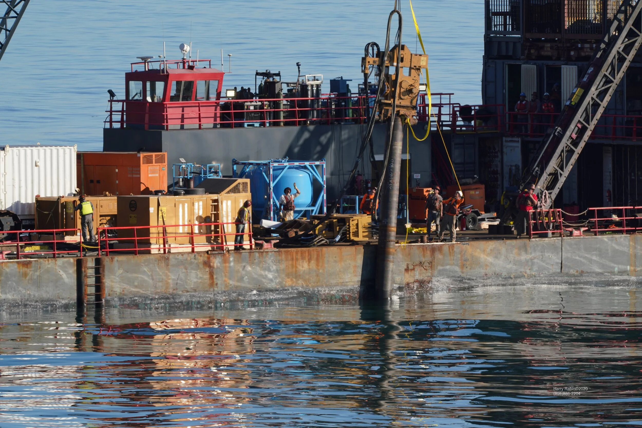 Hammer on Pipe Pile Secured to Barge