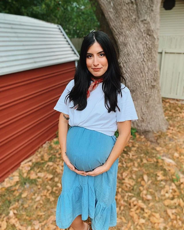 I paired this flowy dress that was a hand-me-down from my MIL with a basic tee I knotted over my bump. 8 months pregnant in this photo.