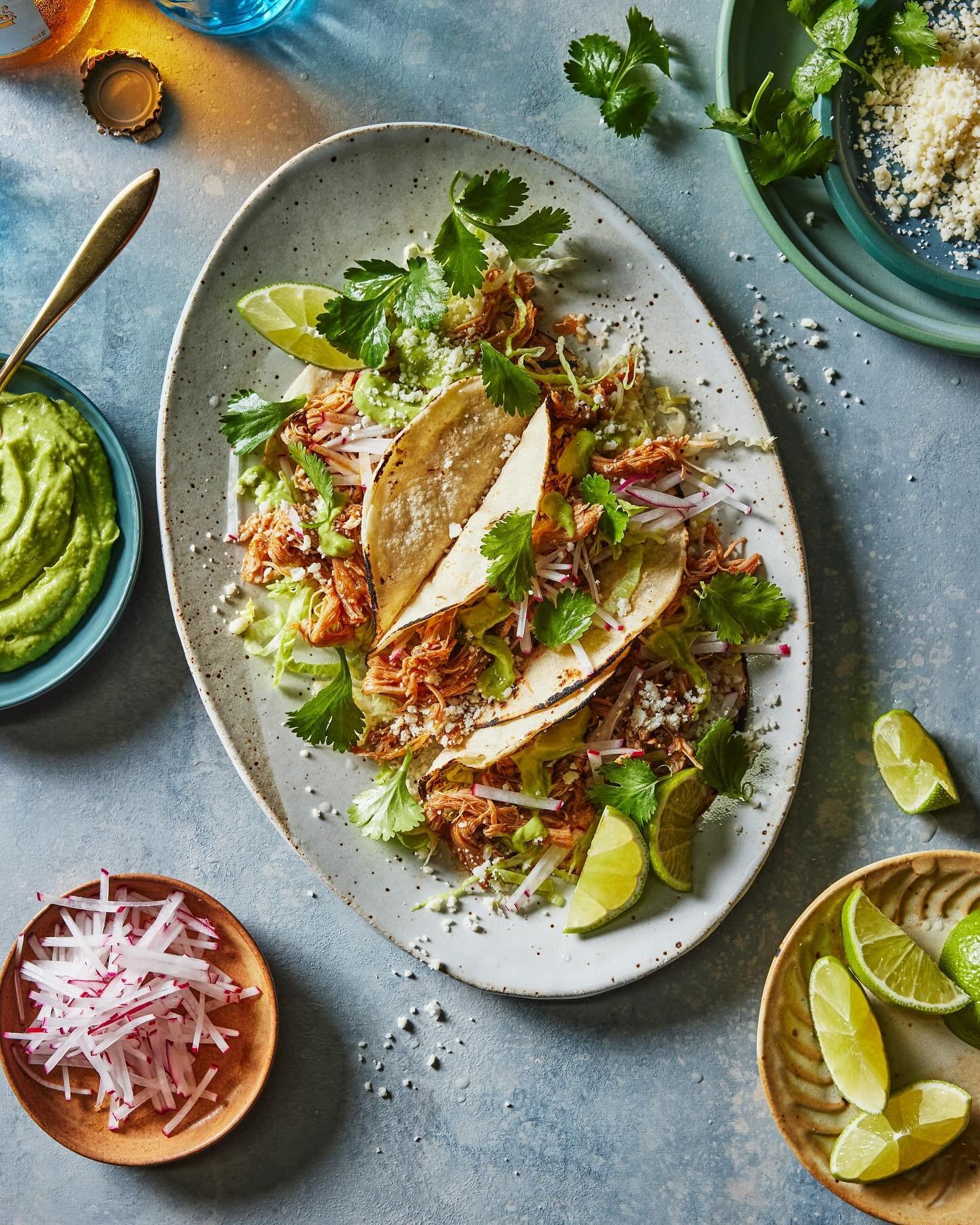 Beer Braised Chicken Tacos - for this shot @adamfoodstyle packed a party on a plate and @thedefineddish brought the flavor. This image is one of my favorites from Alex&rsquo;s new book. I love how all the accoutrements dance around the page, adding a
