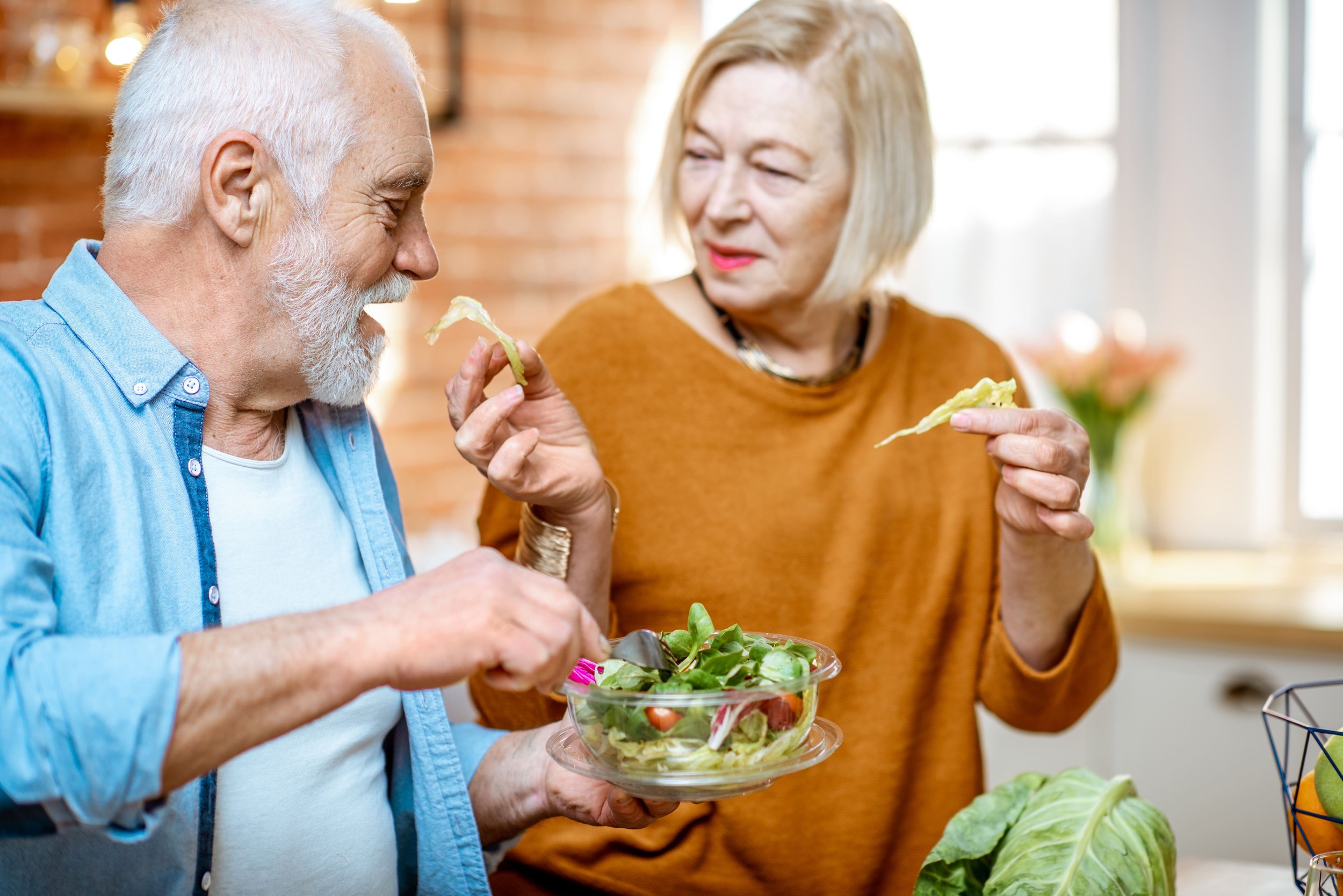 senior-couple-with-healthy-food-at-home-2022-01-19-00-03-37-utc (1).jpg