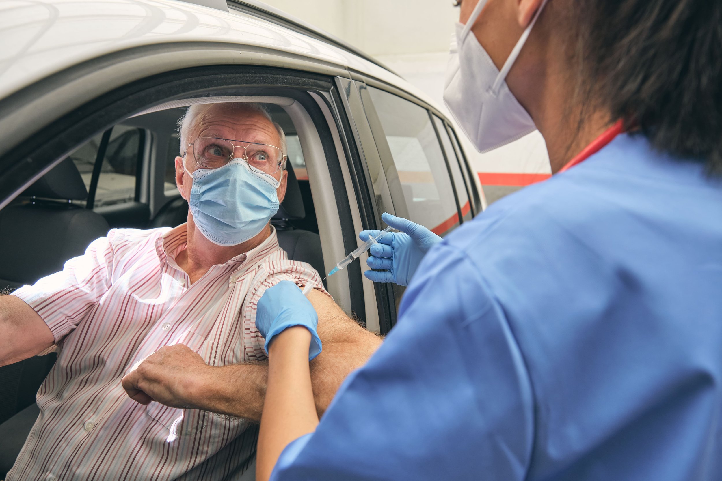 crop-doctor-vaccinating-elderly-man-in-car-with-sy-2023-08-17-18-15-57-utc (1).jpg