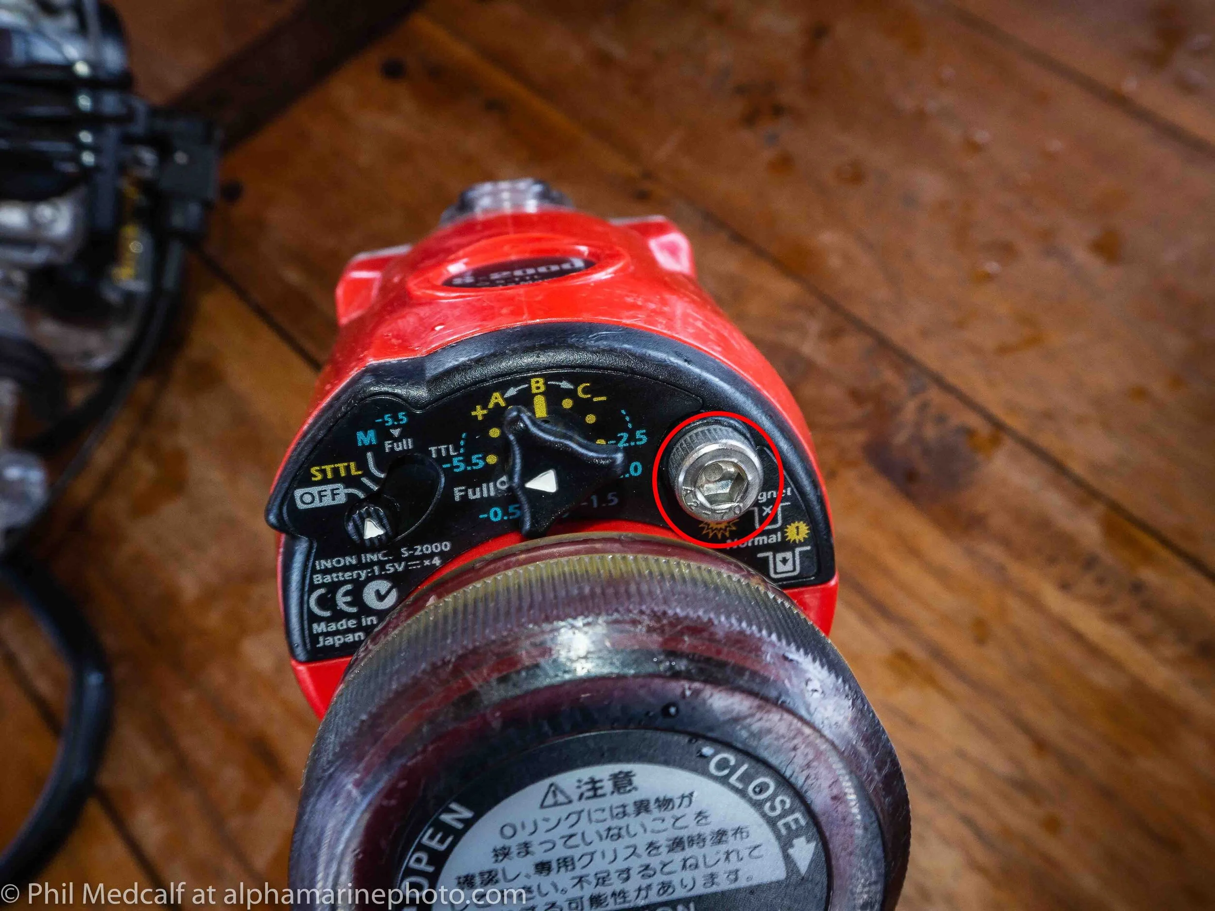One of the most lost items of underwater photography equipment is the little magnet that goes under the screw circled red on this INON S2000. But never fear replacement ones are available and don’t cost a lot.