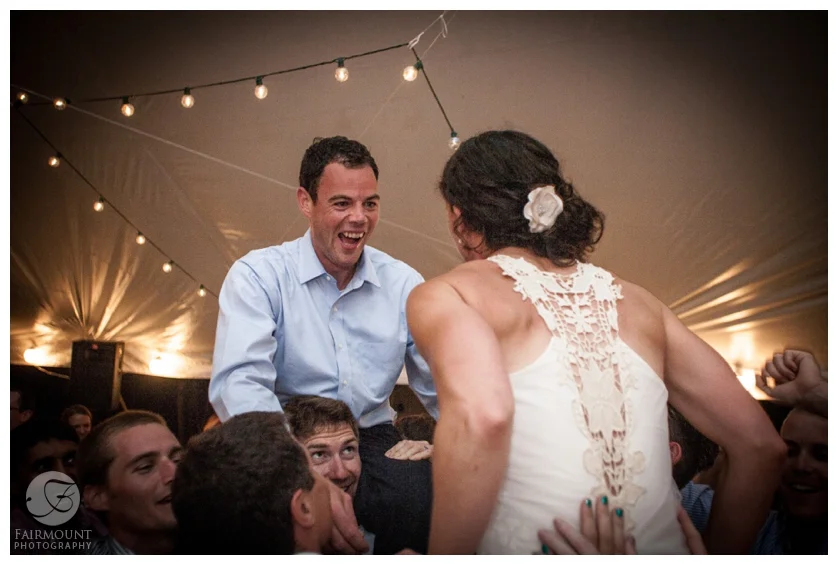 29-Bride and Groom hoisted up