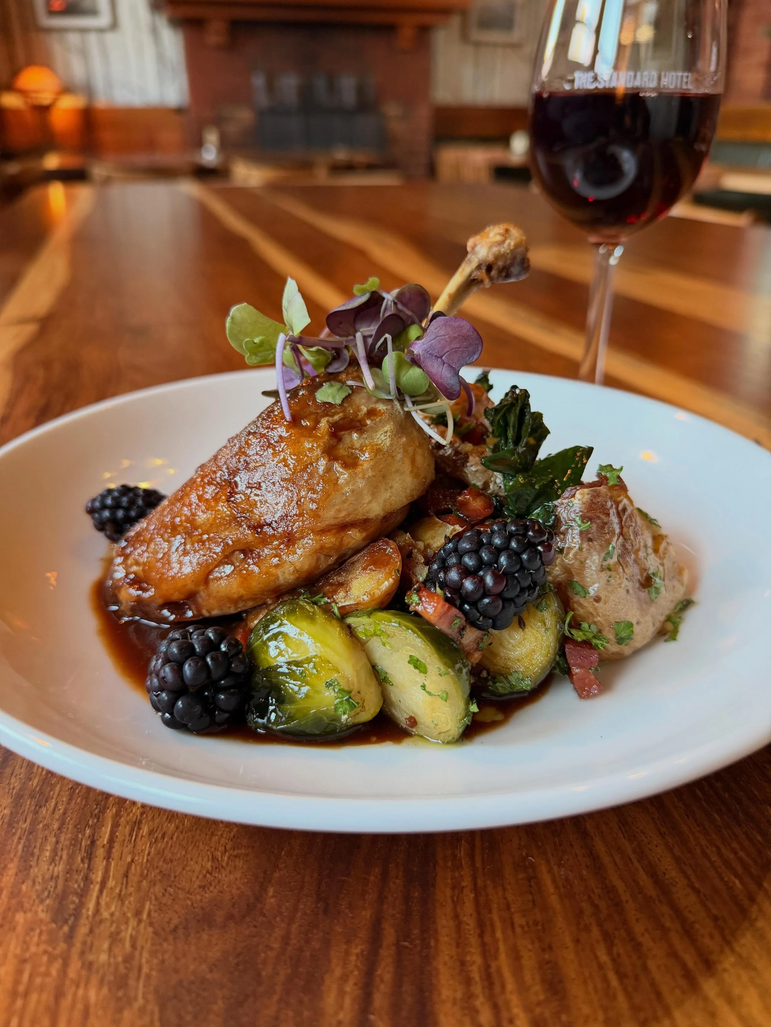 Confit Duck Leg

Served with smashed potatoes, roasted brussels sprouts, smoked bacon, cavalo nero and a blackberry jus.

Available on our specials board until sold out.