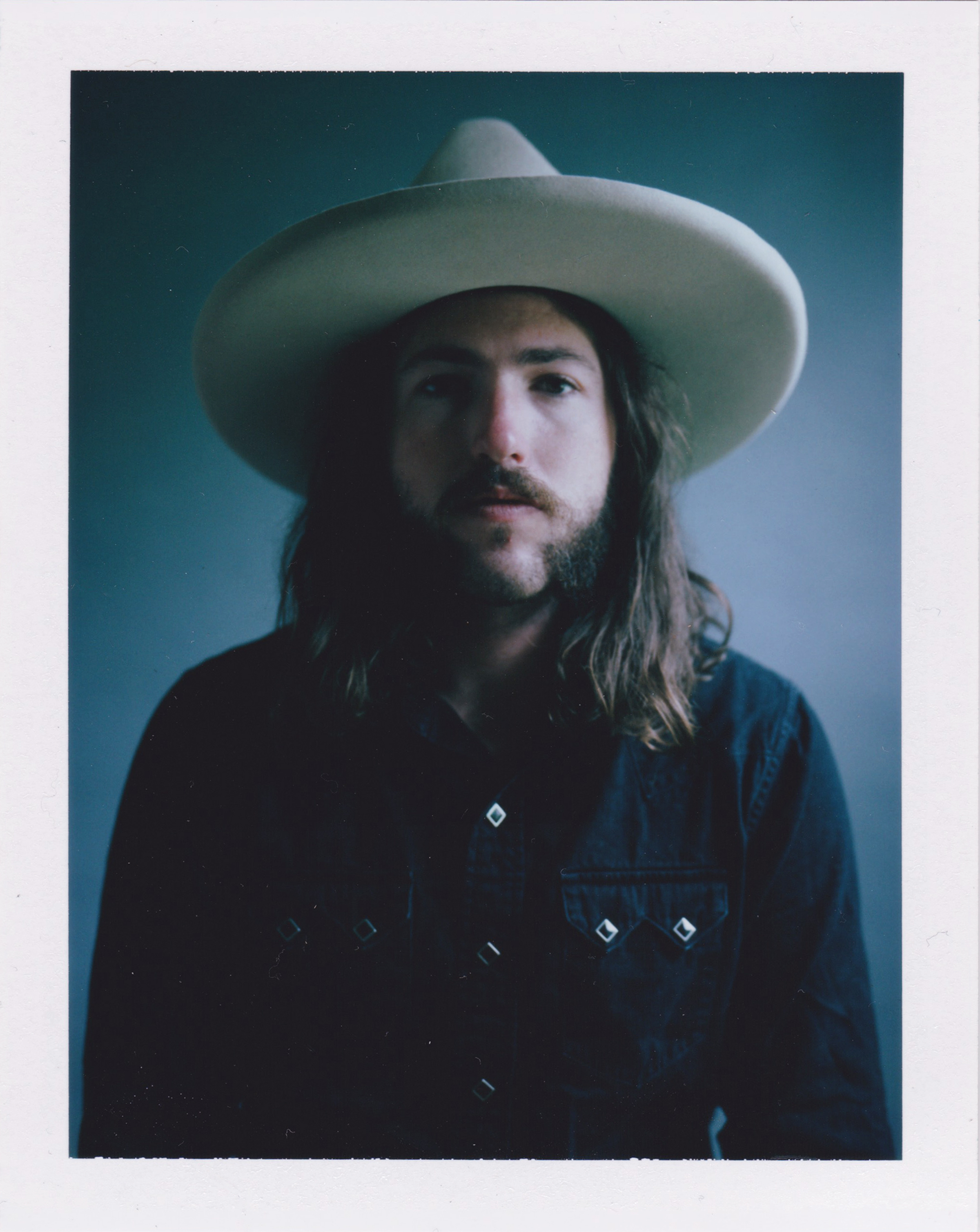   Danielle Atkins  •&nbsp;Nashville, TN  @daniellebatkins   I shot this image for some recent personal portrait work. It has been short on Fuji fp100c polaroid. The portrait is of my good friend Jordan “Solly” Levine. He is a drummer for a few countr