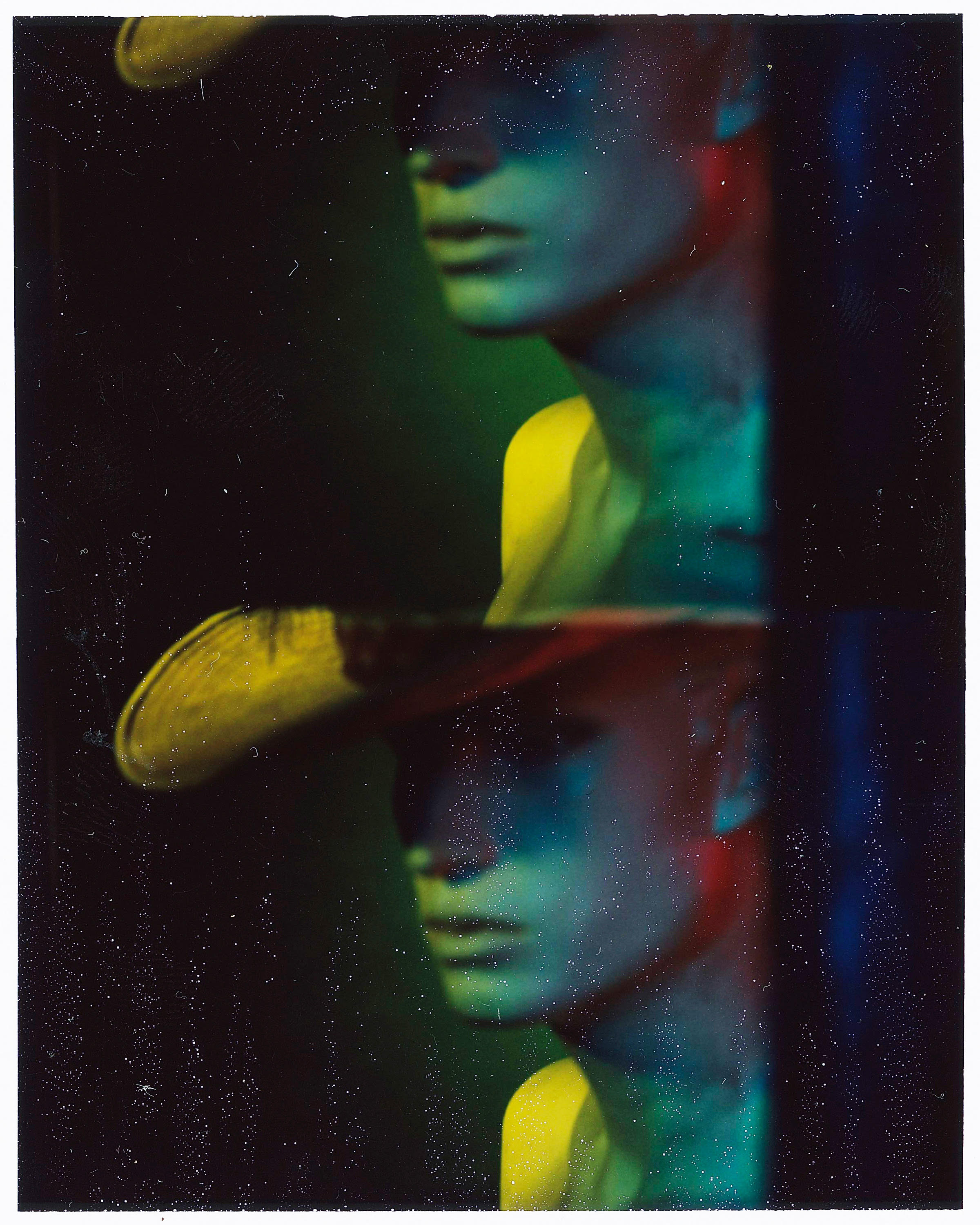   Jer Nelsen  •&nbsp;Marion, IN   This is a Polaroid of a white window model with a Western hat/feather combo. The Image is shot with a passport camera in the studio. When I think of “Western” I think of both consumerist vice and adventure, as well a