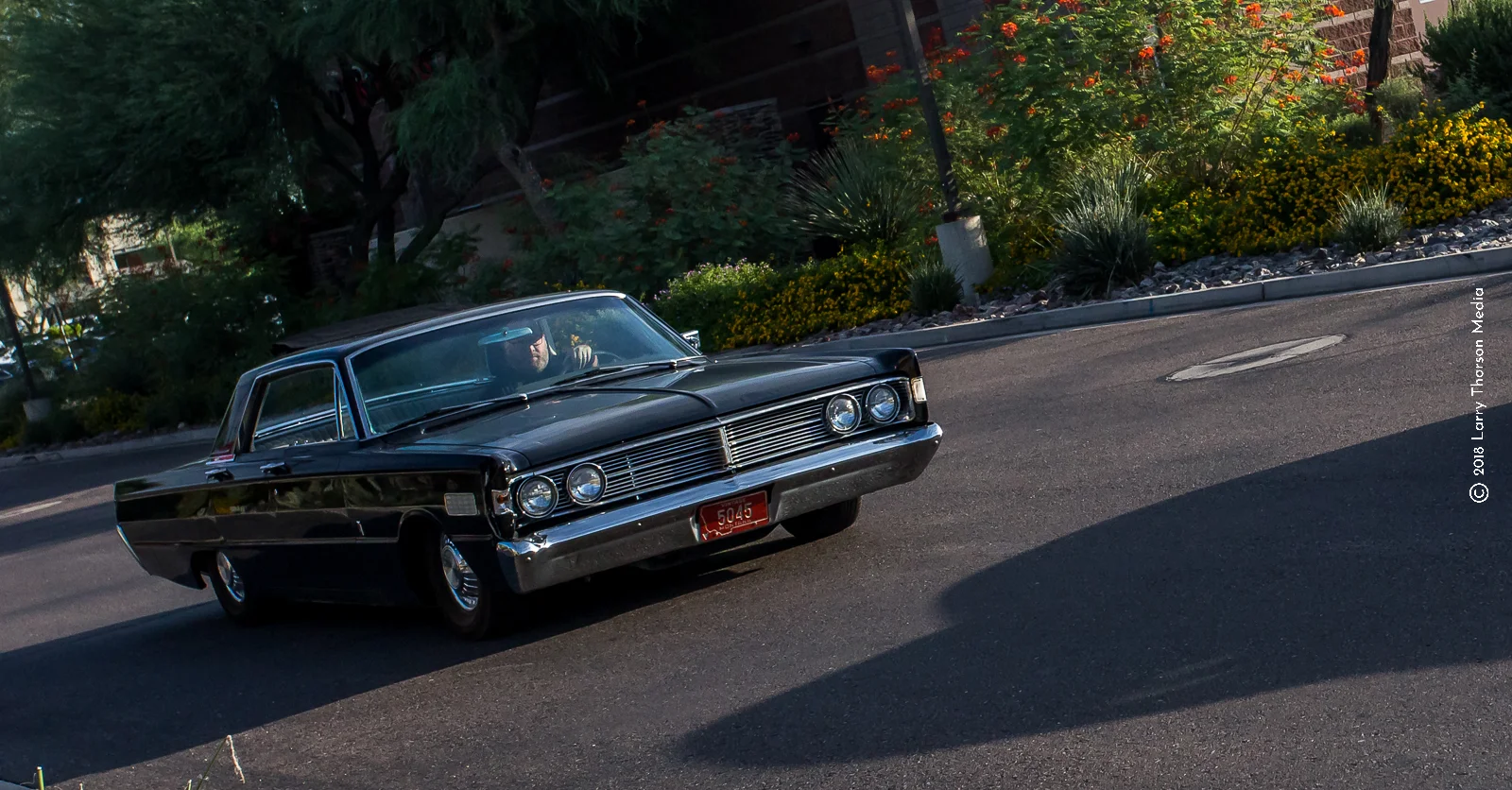 The puny blinkers in the fender blades give it away.