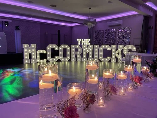 AO Events party setup with DJ, lighting and LED letters