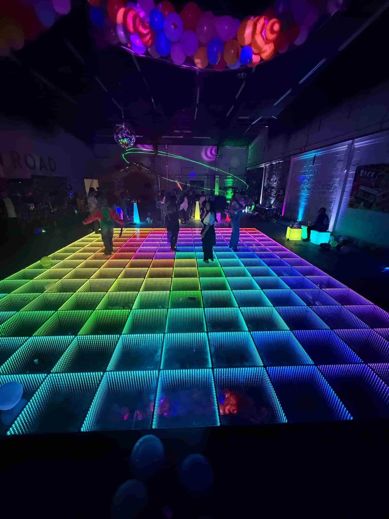 Huge 3D Infinity dancefloor lighting effect in a large event space