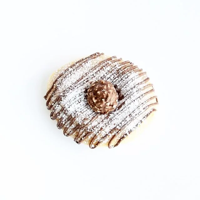 FAN FAVE: NUTELLA β‘οΈ
ORIGIN: April 18th, 2017—One of the very first donuts we ever made! 
MAKEUP: Nutella Drizzle + Icing Sugar Sprinkle + Ferrero Rocher topper
YUM FACTOR: ππΌ