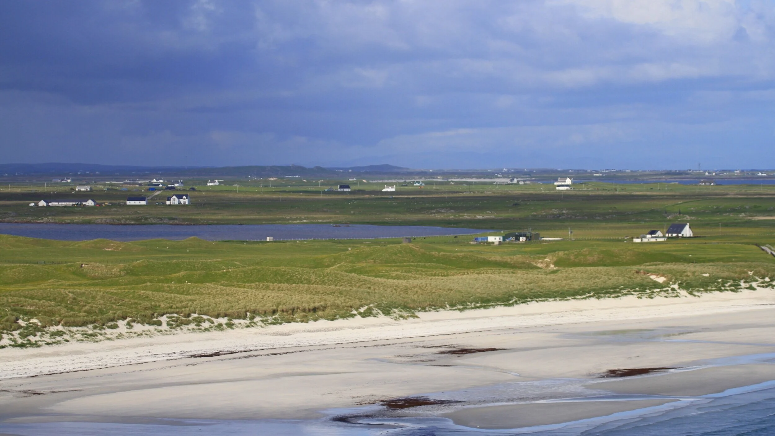 Looking east across Traigh Bhi, you can see sand-blow through the dunes.