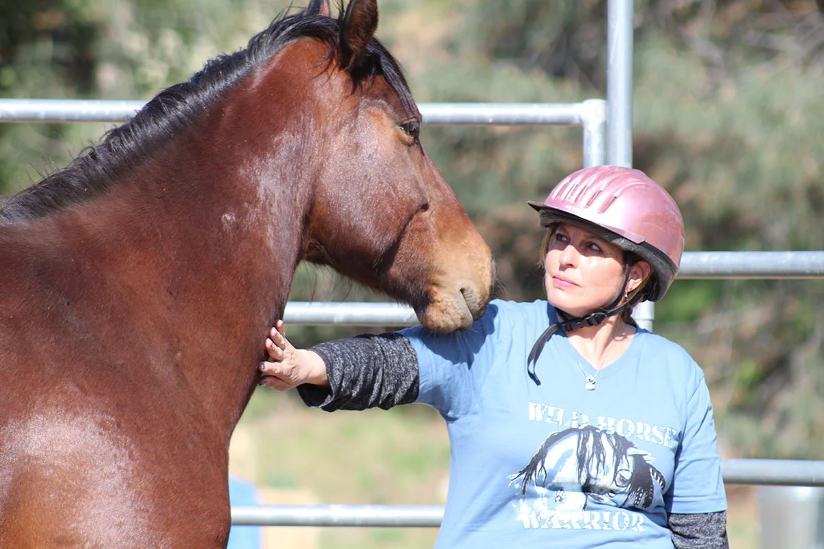 Barbara had never been up close with a horse before- let alone a wild rescued mustang. This is her trusting herself, and letting herself be open to the horse… and the horse responded in kind.