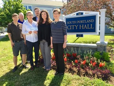 Pictured in the photo above L-R: Dugan Murphy, South Portland Land Trust Program Manager; Kevin Adams, South Portland Parks and Recreation Director; Patti Smith, South Portland Mayor; Chris Morelli, South Portland City Manager; Kate Lewis, South Portland Land Trust President; Sharon Newman, Congregation Bet Ha’am Past President. Photo courtesy of The Sentry.
