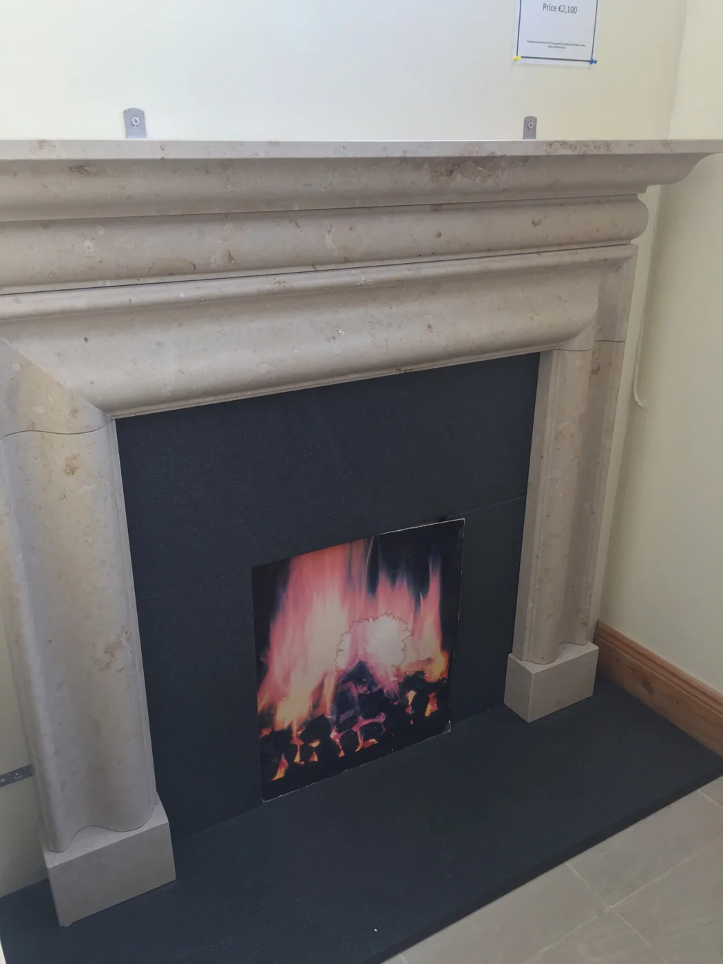 Jura Bolection. Surround in Jura limestone 5’x52”, insert and hearth in leathered granite - €1,700