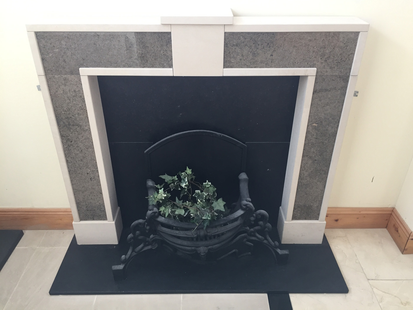 Fireplace with hearth and insert in honed Irish limestone and surround in Portland and Purbeck limestone. One of our own creations - €1,200