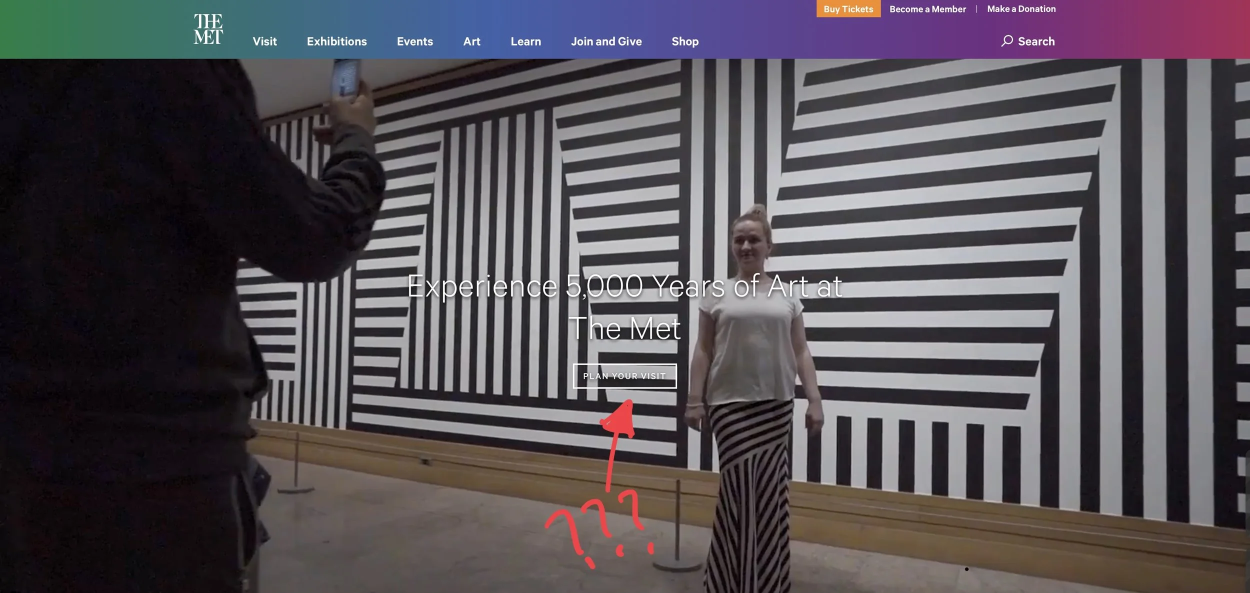 The Met website’s video background with ghost button in the middle
