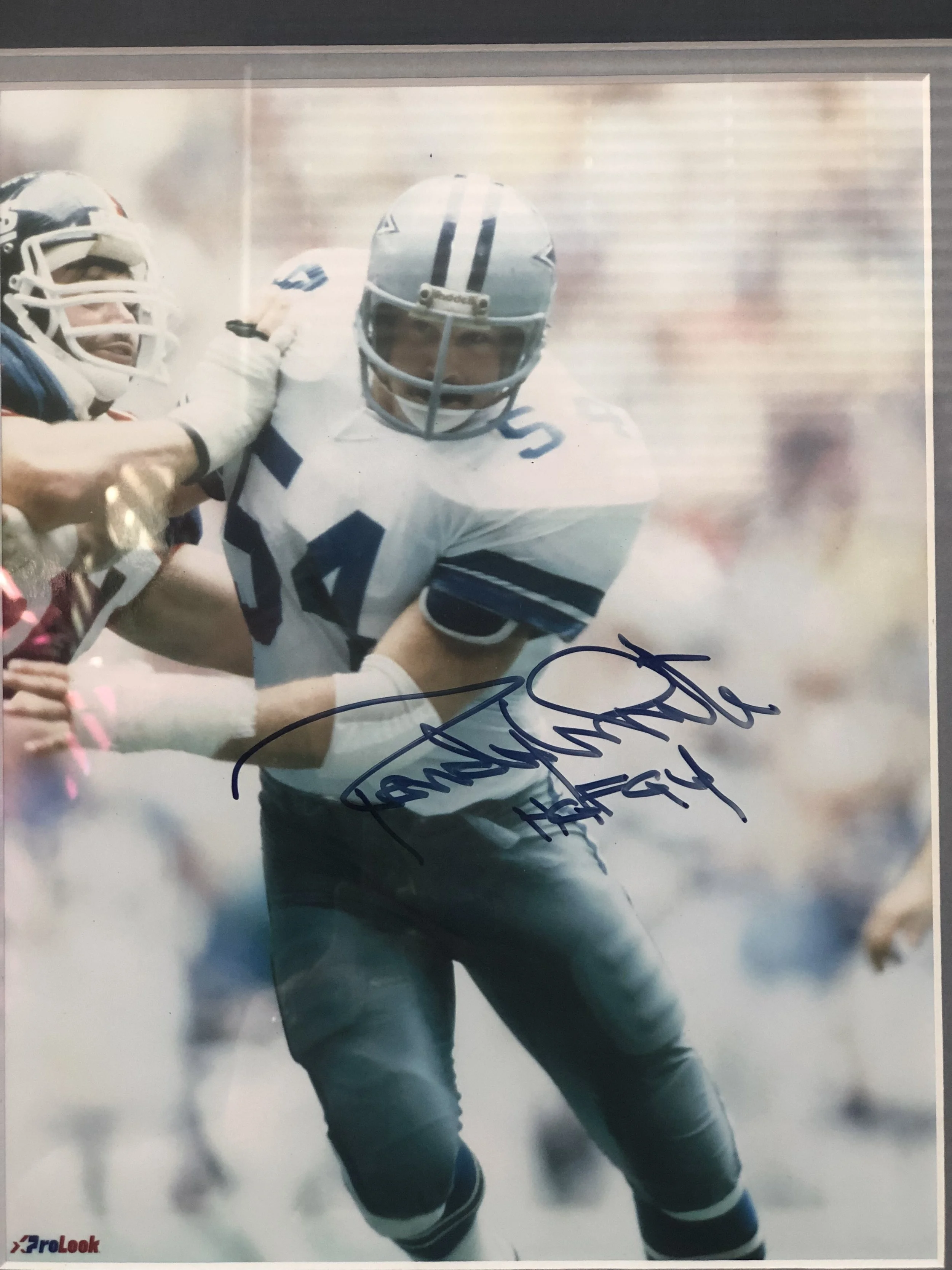 Make your friends jealous with an autographed framed photo of Randy White