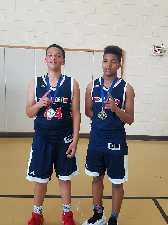 Issiah Evans (left) with his basketball teammate